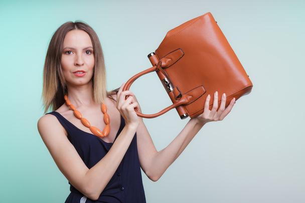 Elegant fashion woman with leather handbag - Foto, Bild