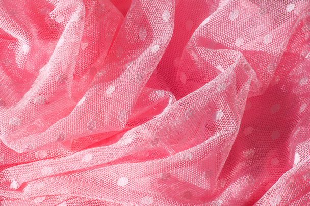 A textura do laço de tecido com lantejoulas no fundo do tecido. um pequeno disco brilhante costurado como um dos muitos em roupas para decoração. Magenta, rosa quente, Cerise
 - Foto, Imagem