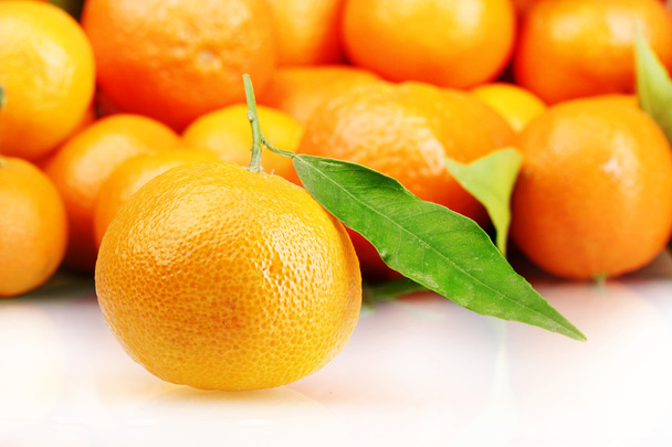 Ripe tasty tangerines with leaves closeup - Photo, Image
