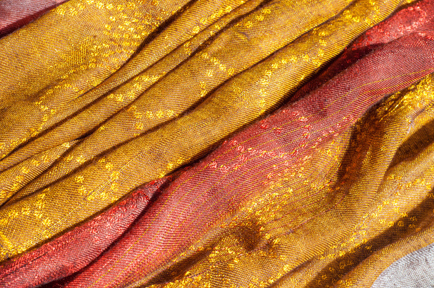 La texture du tissu de laine jaune rouge doré
 - Photo, image