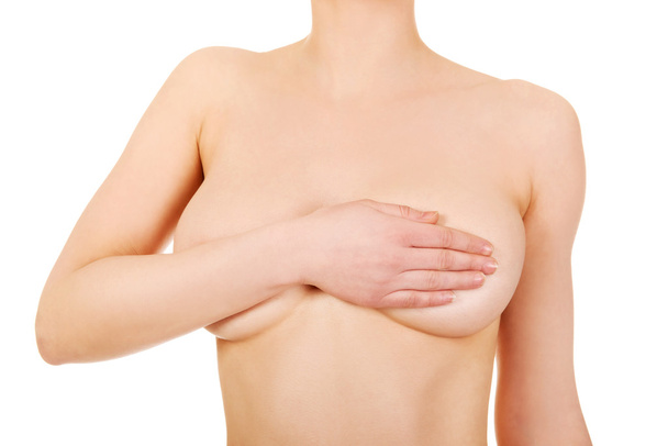 Topless woman covers her breast. - Photo, image