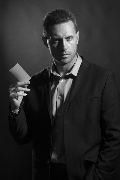Young man with card - Fotoğraf, Görsel