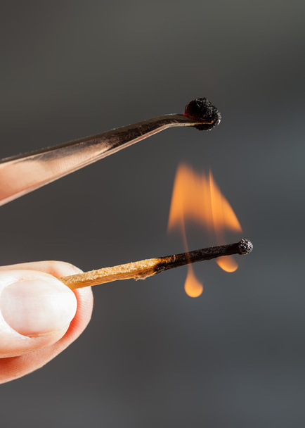 match flame ignites silk tissue sample - Photo, Image