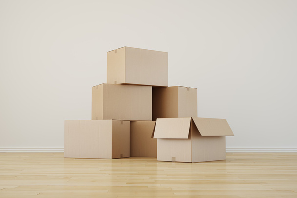 Cardboard boxes in empty room - Фото, изображение