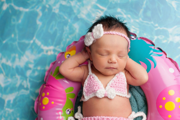 Sleeping Newborn Baby Girl Wearing a Bikini
 - Фото, изображение