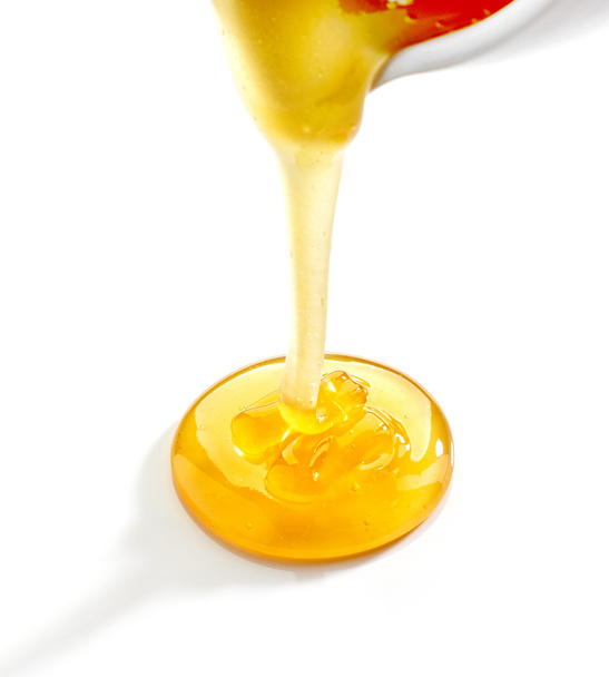 pouring honey - Zdjęcie, obraz