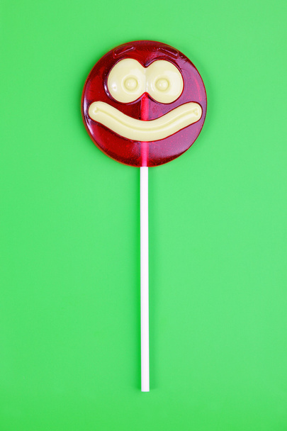Round lollipop, like a smiley face on - Фото, зображення