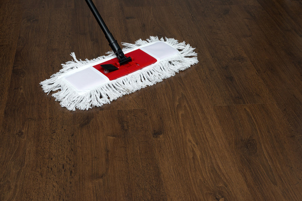 The mop on the parquet floor during cleaning - Photo, Image