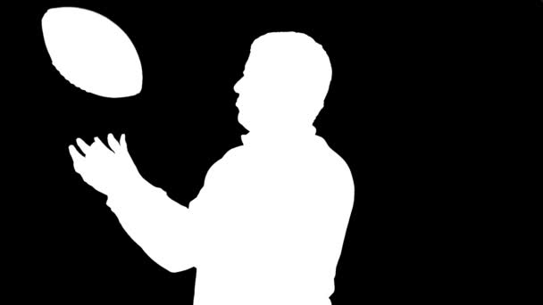 Man Throwing Football and Posing (Silhouette) - Footage, Video