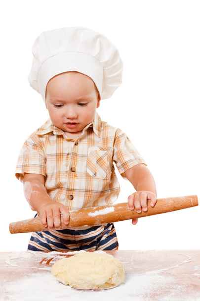 Cute kid rolls cook pizza dough. Isolated on white  - Foto, Imagem
