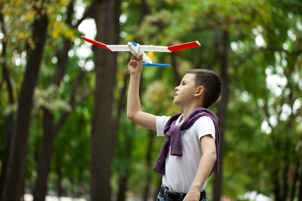 Boy holds airframe - Fotó, kép