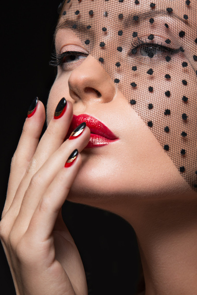 Beautiful girl with a veil, evening makeup, black and red nails. Design manicure. Beauty face. - Foto, afbeelding