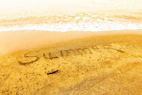 Inscription beach sand Summer. Concept photo of summer travel and vacation. - Fotó, kép