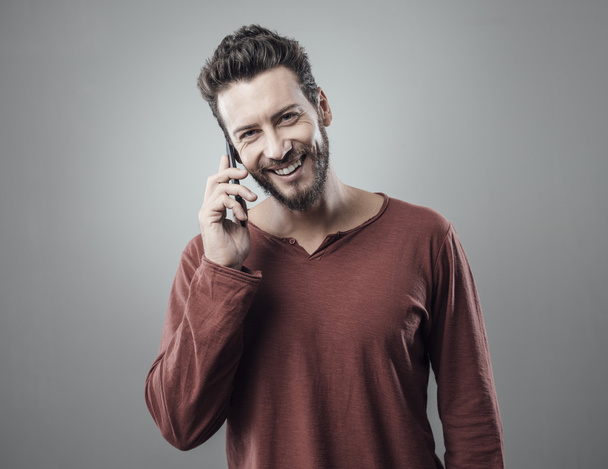 Young man having a phone call - Foto, afbeelding
