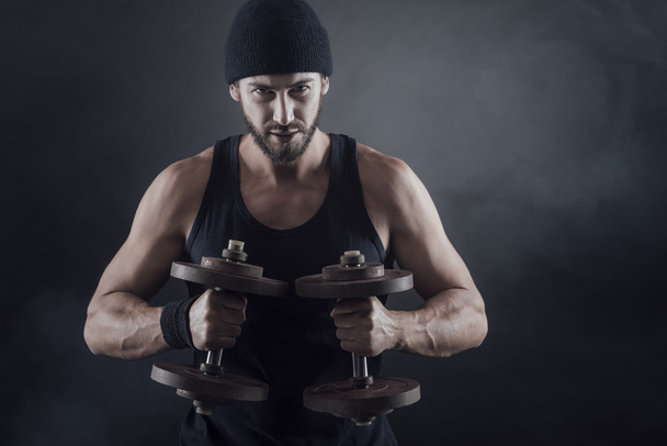 attractive man lifting weights - 写真・画像