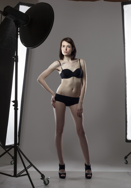 Image of leggy girl posing in studio photography - Foto, imagen
