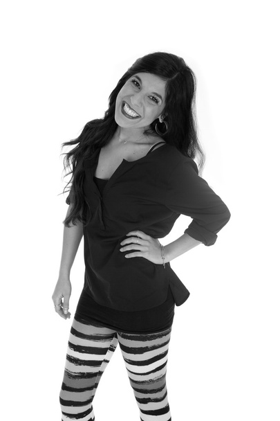 Attractive tan woman wearing striped leggings black and white - Foto, imagen