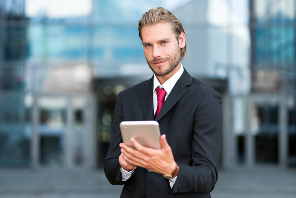 businessman using his tablet - Photo, image