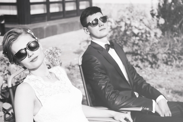 trendy bride and groom in sun glasses - Фото, изображение