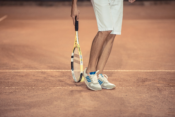 Male legs with tennis racket  - Fotoğraf, Görsel