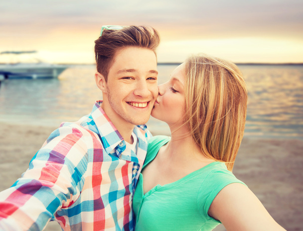 happy couple taking selfie on summer beach - Photo, Image