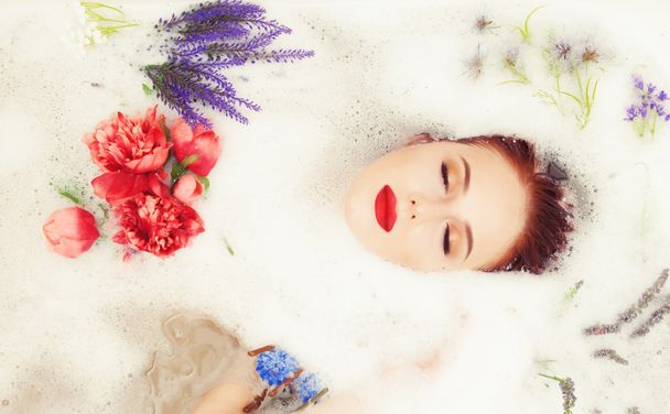 girl in the bathroom with flowers - Photo, Image