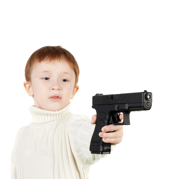 little boy with big pistol - Фото, зображення