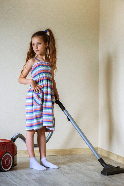 small girl with vacuum cleaner - Fotó, kép