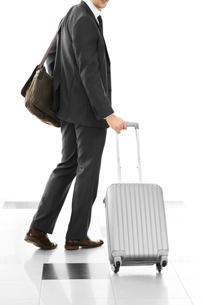 Man holding suitcase   - Foto, afbeelding