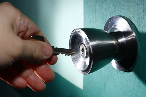 Unlocking a Door - Photo, Image
