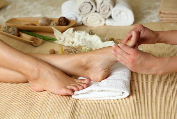 Masseur making feet massage in spa salon - Foto, immagini