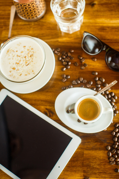 Freelancer workplace on wood background. Espresso, porridge and  - Фото, изображение