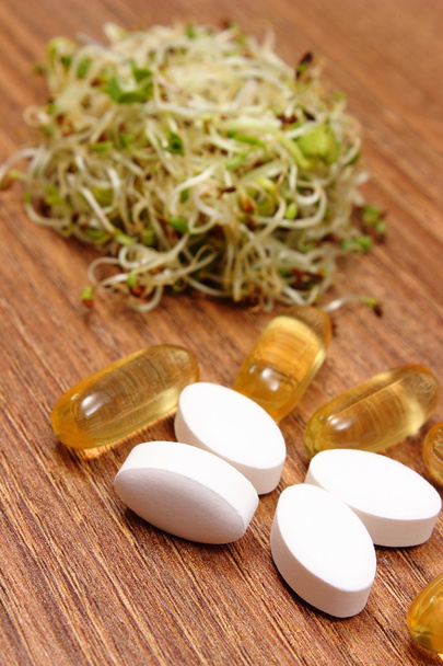 Tablets supplements with alfalfa and radish sprouts, healthy nutrition - Photo, Image