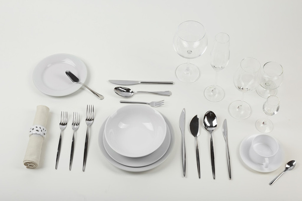 Table setting, close up, on white background - Foto, afbeelding