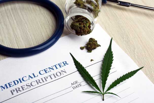 Medical prescription with dry cannabis on table close up - Valokuva, kuva