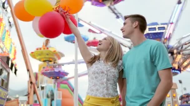 couple visiting an amusement park arcade - Footage, Video