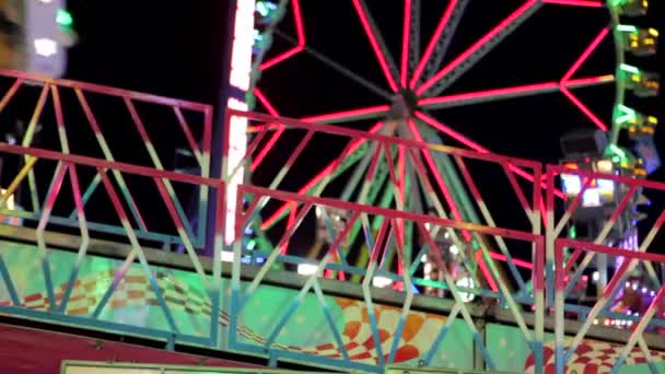 ride coming in and out of frame at a fun fair - Footage, Video