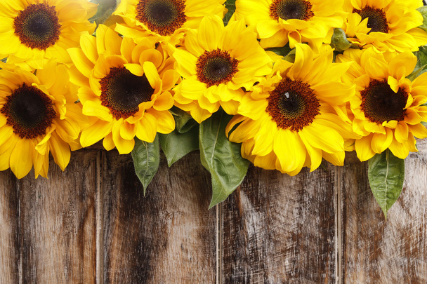 Sunflowers on wooden background - Foto, Bild