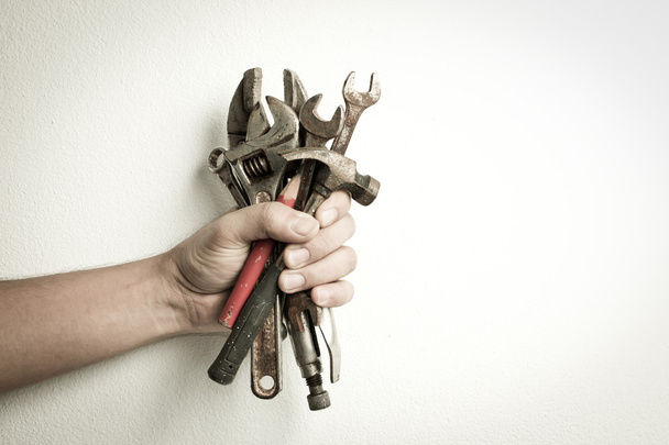 Hand of male holding old tools - Foto, Imagen