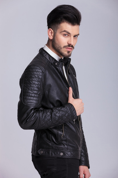  business man holding his hand on the leather jacket  - Zdjęcie, obraz