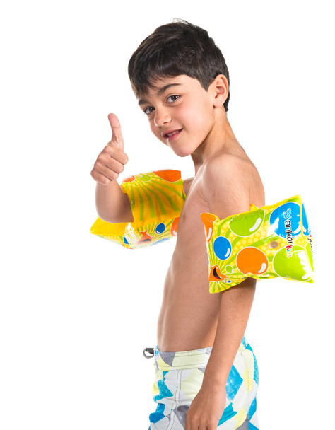 Boy in swimsuit making ok gesture - Fotografie, Obrázek