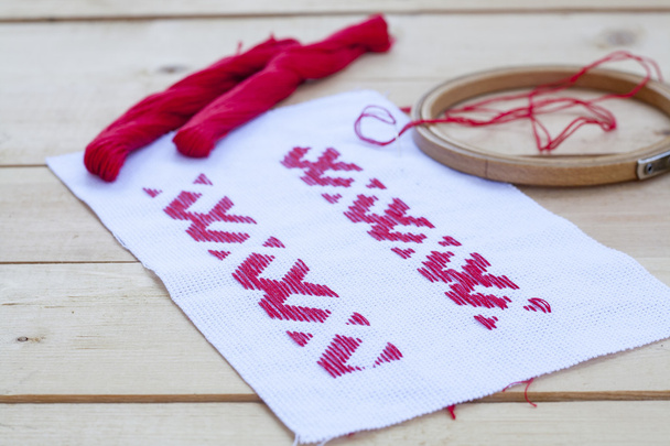 Ukrainian national red embroidery thread, selective focus - Fotoğraf, Görsel