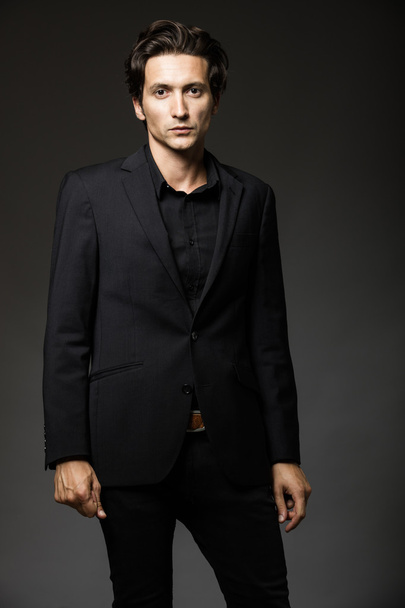 attractive man in black suit - Foto, Imagen
