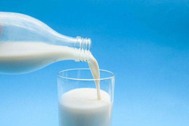  with milk on blue background  - Foto, Bild