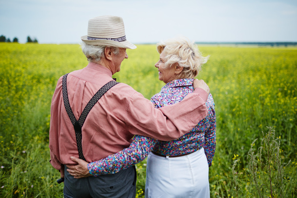 affectionate seniors in the field - Photo, Image