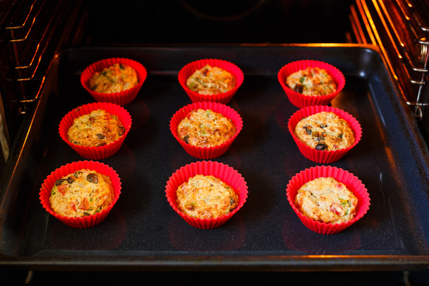 Cakes are baked in the oven - Photo, Image