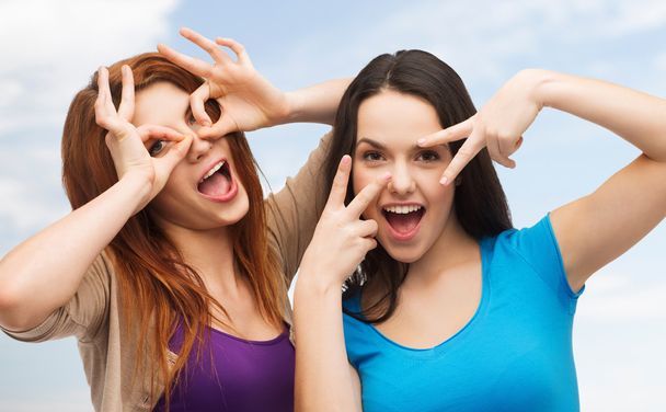 smiling teenage girls having fun - Фото, зображення