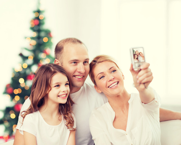 happy family with camera at home - Zdjęcie, obraz