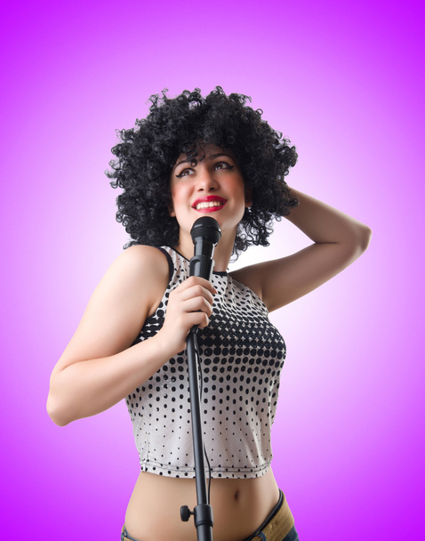 Pop star with mic  on purple - Foto, immagini