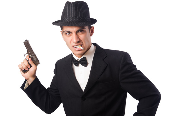 Молодий елегантний чоловік тримає пістолет ізольовано на білому
 - Фото, зображення